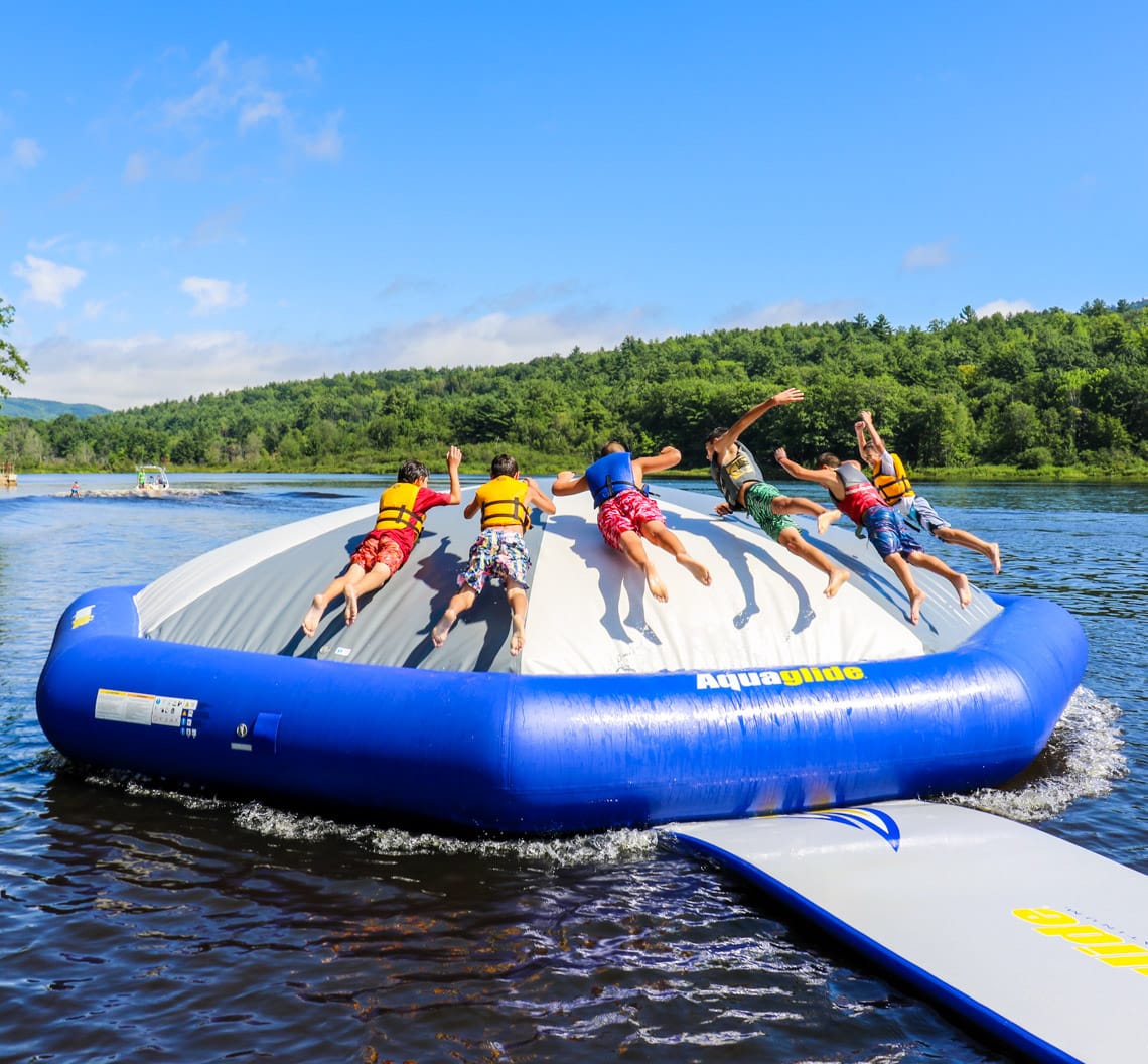 Boys bouncing on Aquaglide inflatable