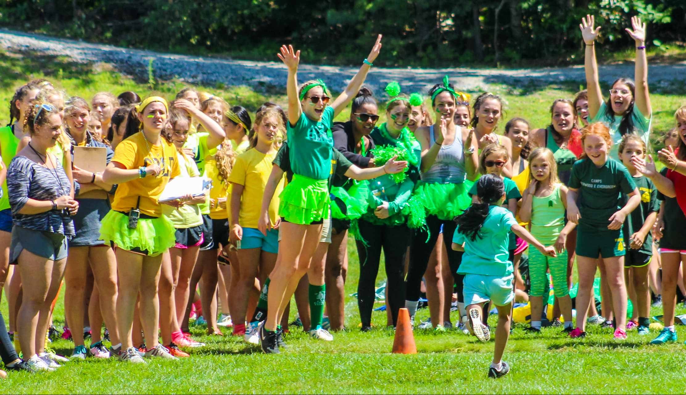 Running for color war competition and campers cheering