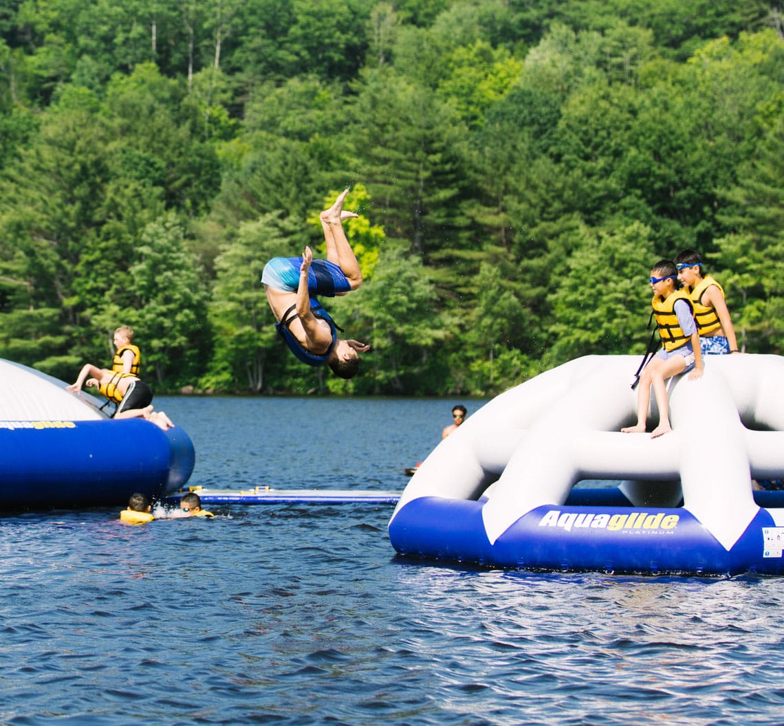 Jumping off waterpark into lake