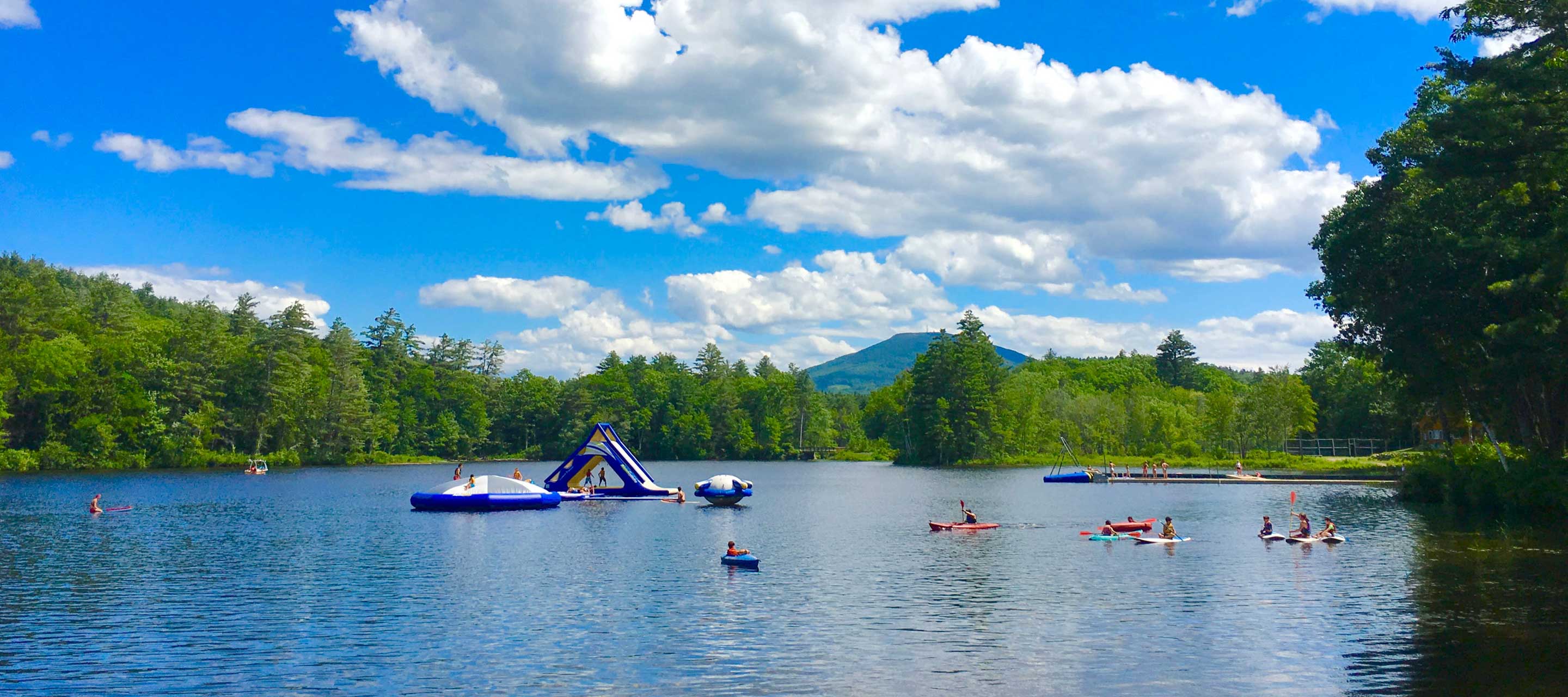 Lake with water inflatables and boats